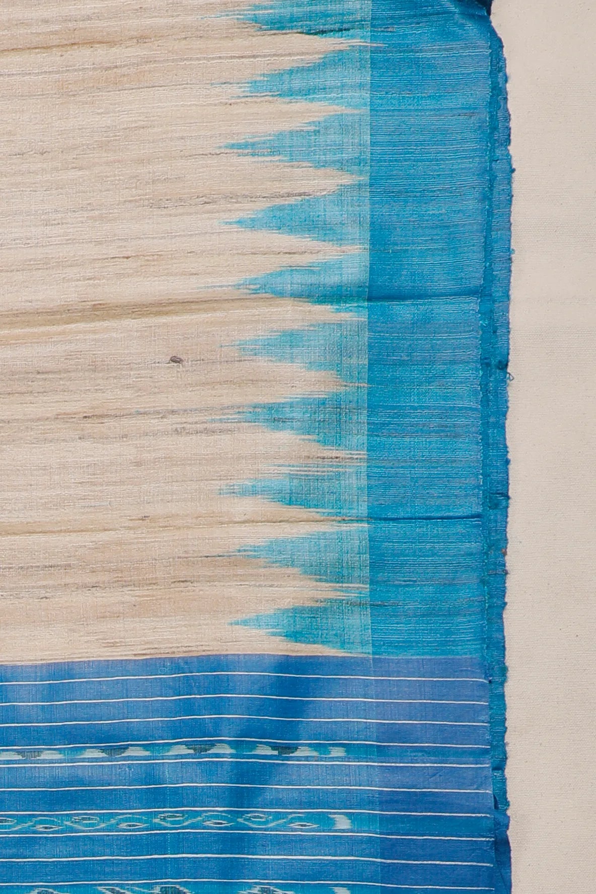 Beige Orissa Ikkat Tussar Pure Silk Handloom Saree with Blue Temple Border